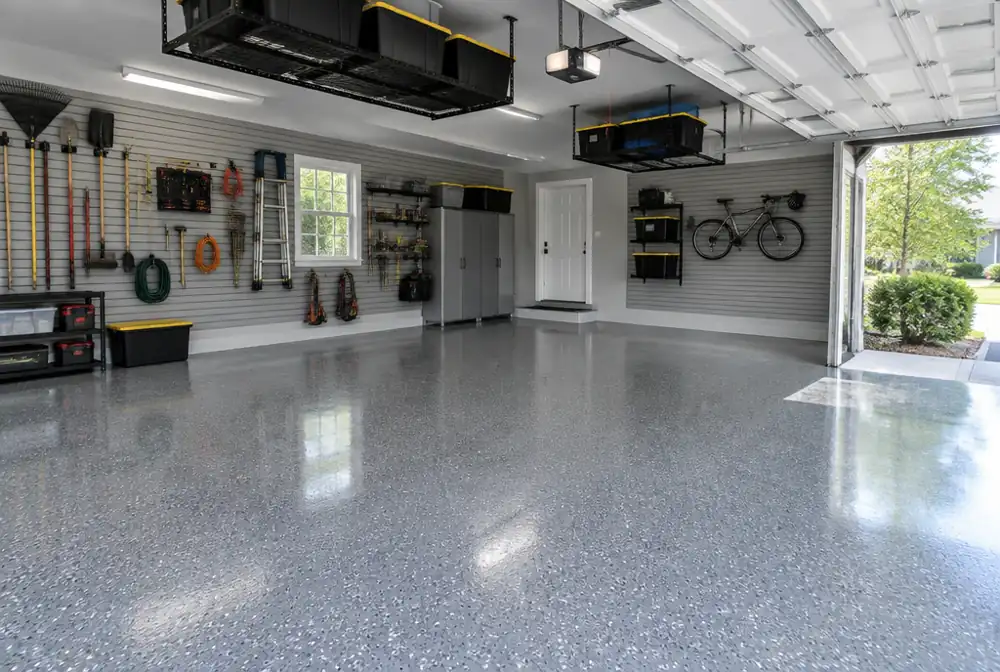 A garage with a new flake floor coating and wall storage