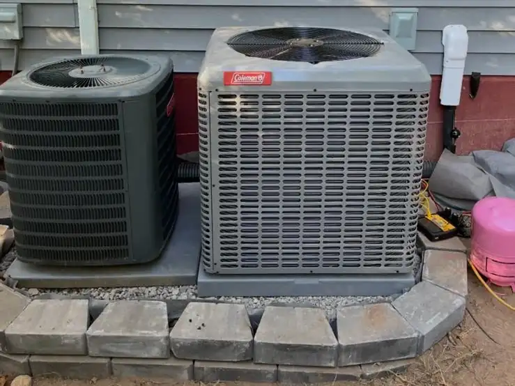 Two central air condensers we replaced on a new paver pad