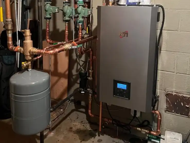 A new wall-hung high-efficiency boiler we installed with new copper piping and zone pumps