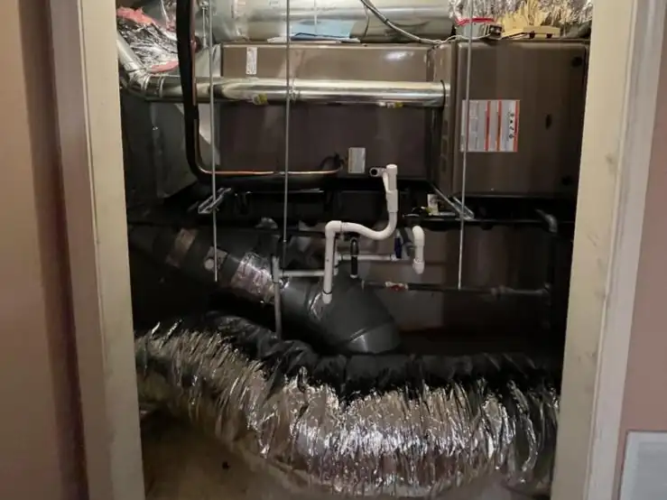 An air handler and ductwork we installed in a hallway closet