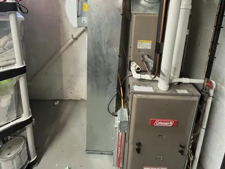 A new high-efficiency gas furnace with PVC venting and a whole-house humidifier we installed