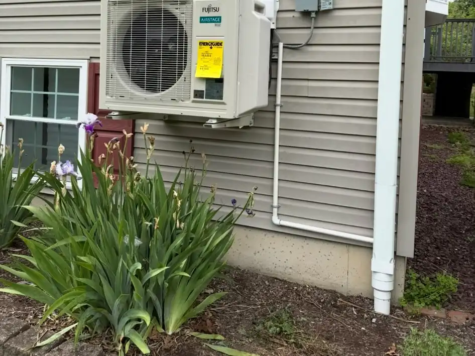 A ductless mini-split condenser we installed on the side of a New Jersey home