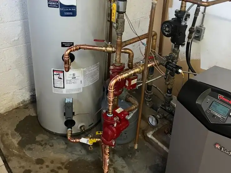 A new water heater and high-efficiency boiler we installed with clean copper piping